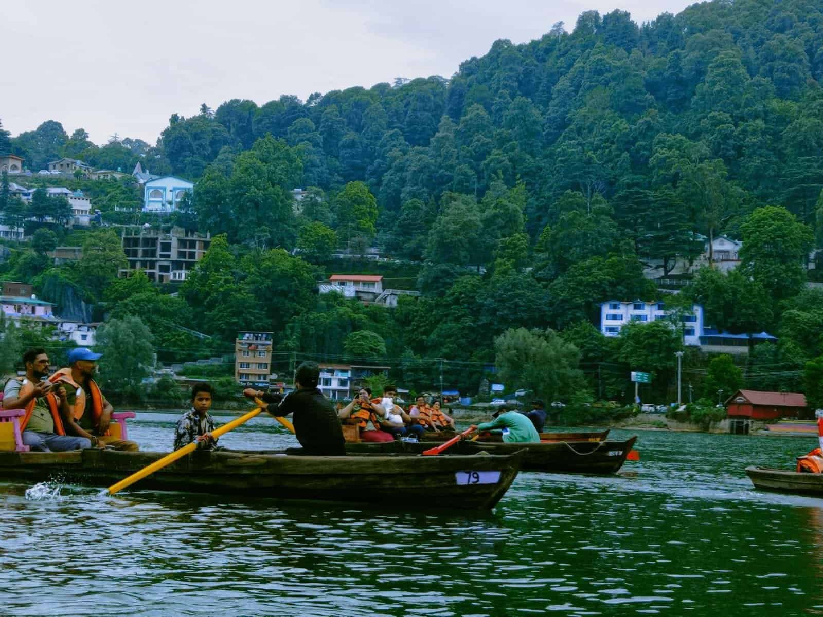 Scenic private yacht cruise on Nainital's iconic Naini Lake surrounded by green hills